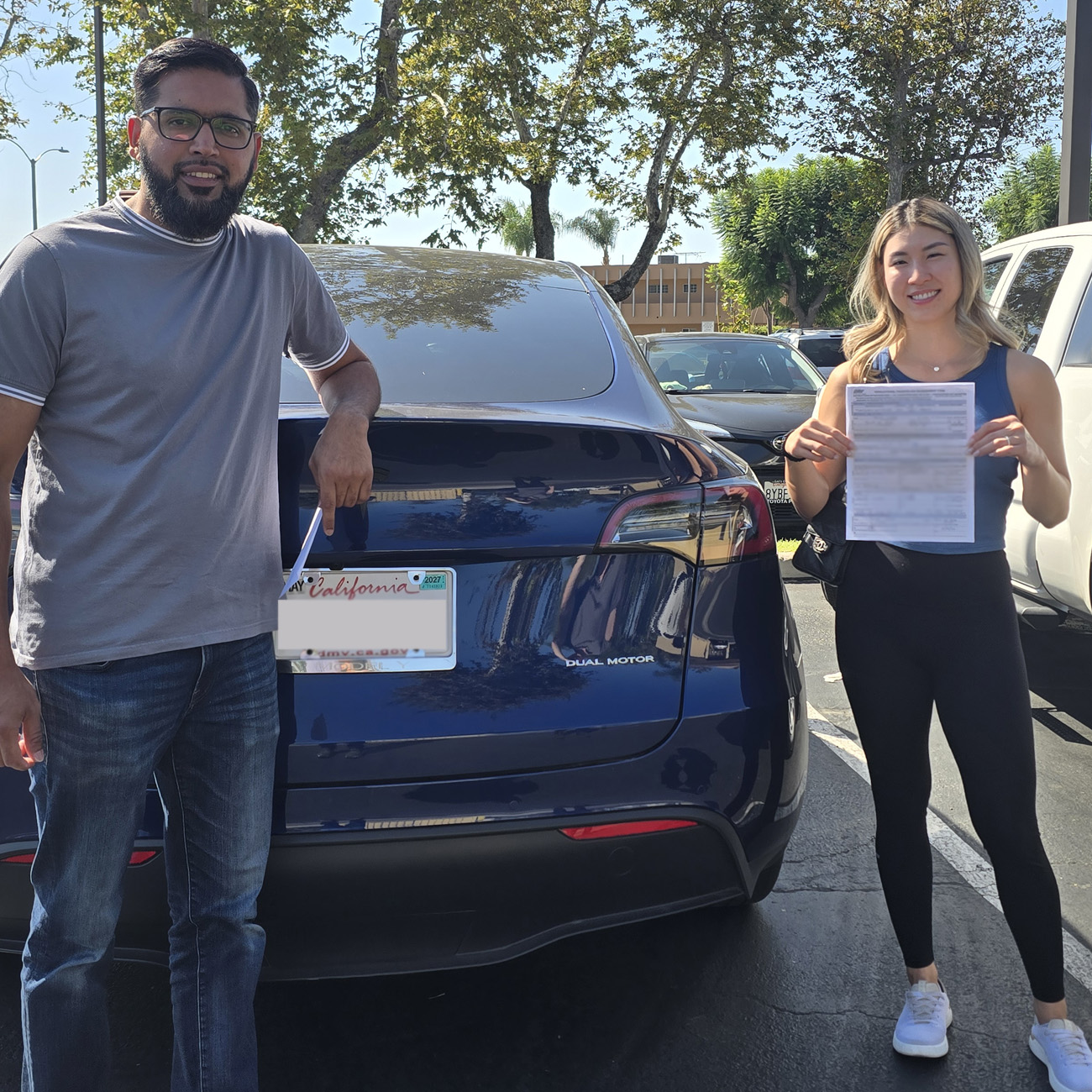 Private seller handing over vehicle paperwork to South OC Autos